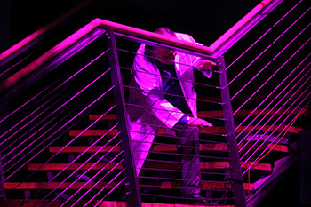Peter Weibel is playing on the ropes of the ZKM stairs.